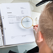 Close-up Of Businessman Inspecting Bills