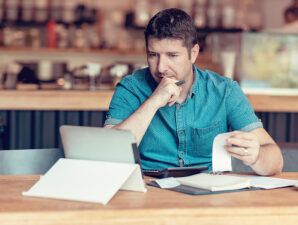 Man reviewing monthly financial statements